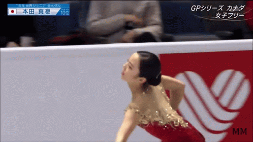 the woman in blue and white dress is skating