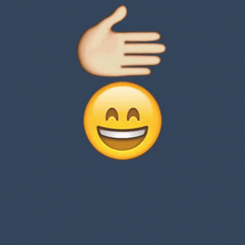 the person's hand that is in front of the smiling face has two thumbs up and down