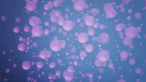 an orange background with pink bubbles in it