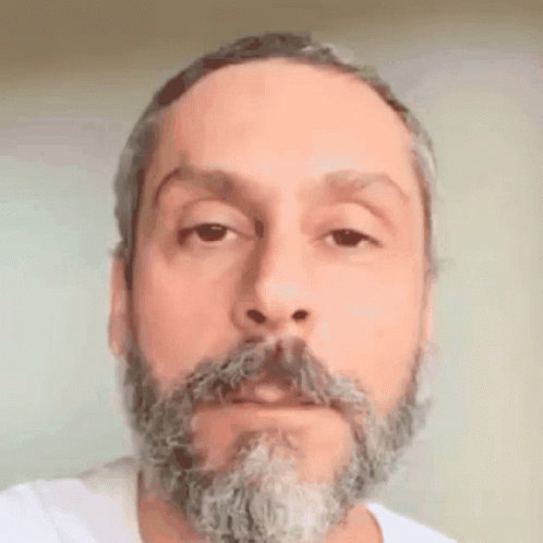 an old picture of a man with grey hair and beard