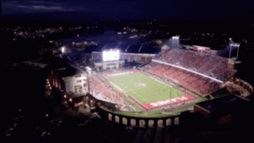 an aerial view of a football stadium at night