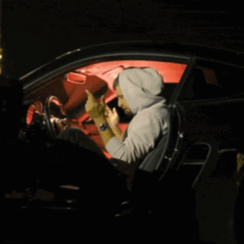 person in a car getting ready to drive