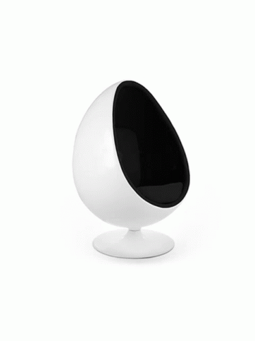 an egg chair in white with black interior