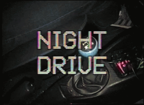 a digital text that reads night drive in a dark room