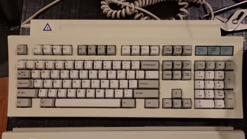 a white keyboard and mouse on a desk