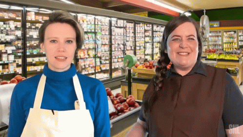two women that are standing together in a store