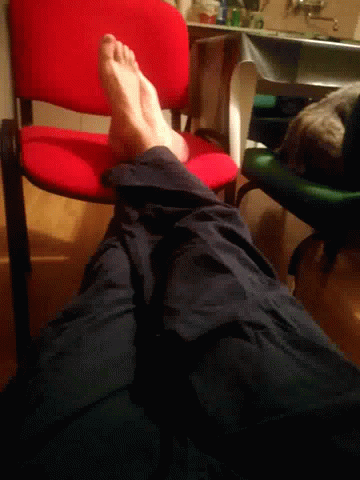 feet and legs seen while sitting in chair with no shoes