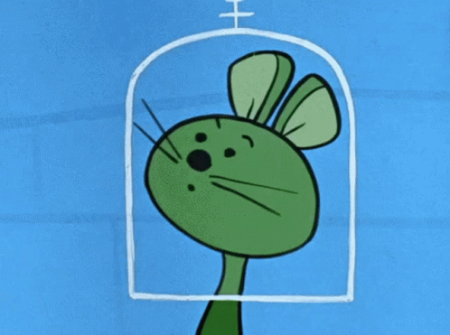 a green rabbit in front of a window
