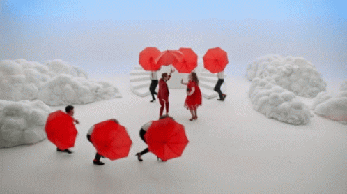 a group of people that are holding umbrellas