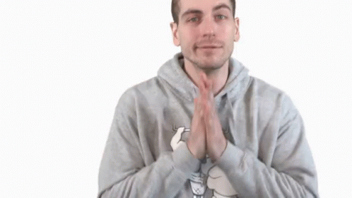 man in hoodie clapping hands on a white background