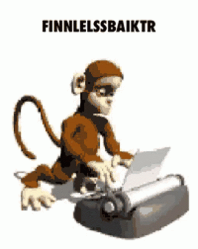 a computer monkey sitting on top of a printer