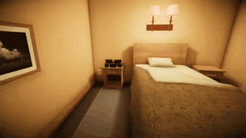 a dimly lit room with two identical beds