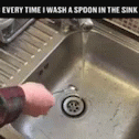 there is a person washing the dishes in the sink