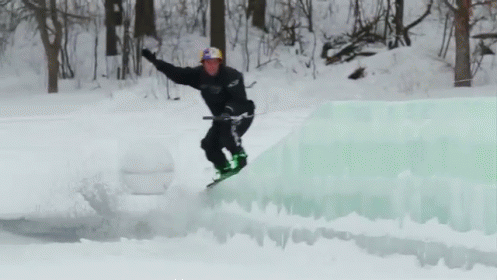 a person that is snow boarding by some water
