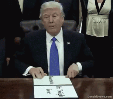 a fake donald trump appears to be appearing as a person signing a document