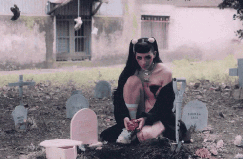 a woman dressed as a geisha in the cemetery