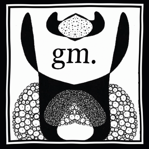the picture features two large heads and the letters g m