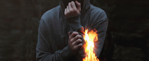 a person is wearing a hooded hood and holds their hands out toward them