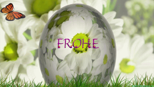 an easter egg sitting in the grass with the words frohe painted on it