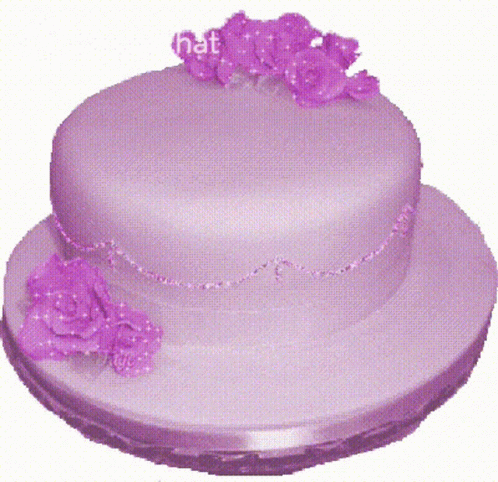 pink cake with floral decorations and beaded trim