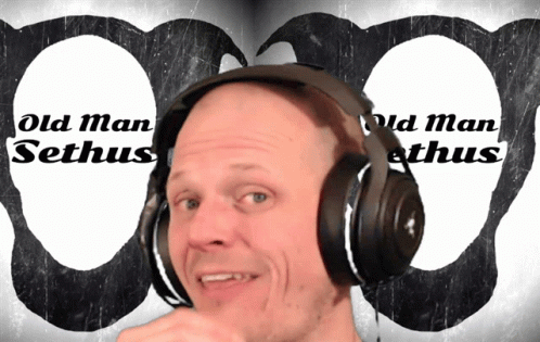 a man in headphones is staring at the camera