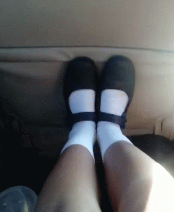 a person wearing black and white socks and some socks