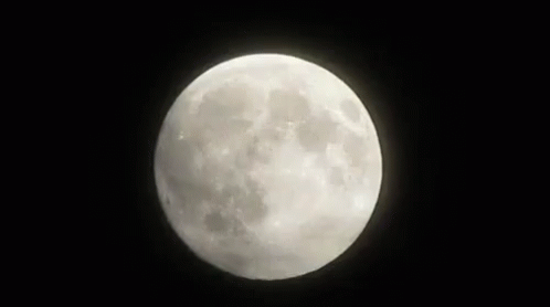 a close up of the full moon in the dark sky