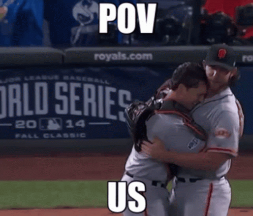 this is a picture of two baseball players hugging