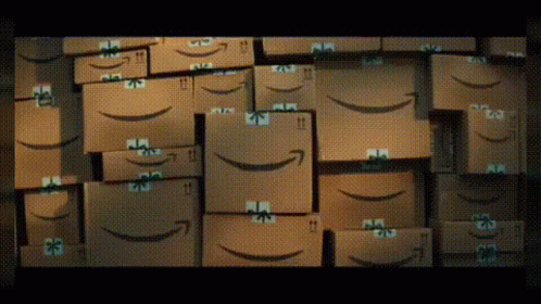 boxes of amazon smile face are stacked up together