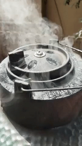 a smoke filled stove top is shown sitting on a table