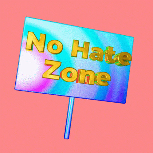 a sign in a purple sky that says no hate zone