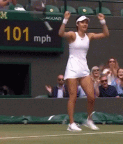 a woman playing tennis in the middle of a match
