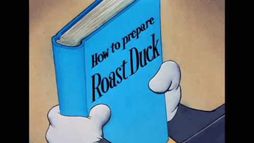 a person holding a book with the words how to prepare roast duck on it