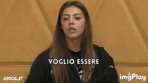 a female is making a face and has the words vocilio essene in front of her