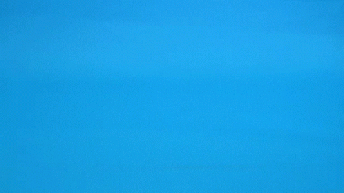two planes are flying over the ocean with a light yellow background