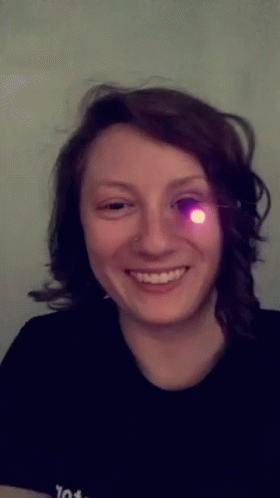a person with eye lights glowing on the side