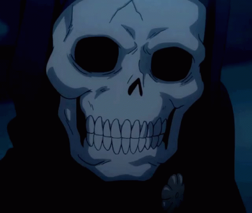 a strange human skull in a dark costume