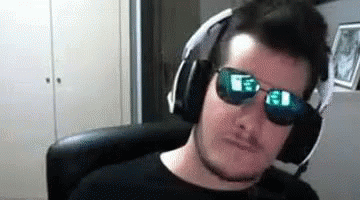 man with headphones wearing pair of sun glasses