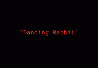the word dancing rabbit is written in bright blue neon letters