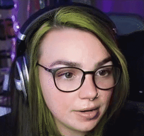 a person with green hair and glasses
