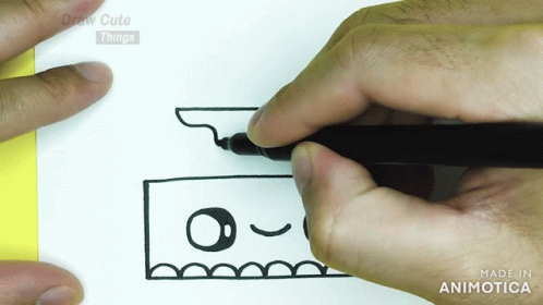 hands with a pen draw a face on white paper