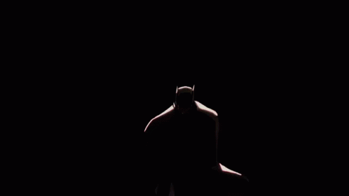 the silhouette of the torso in a dark room