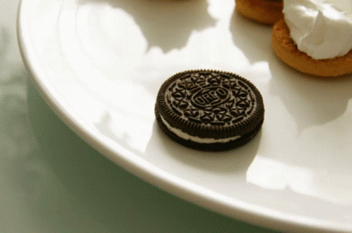 an oreo cookies sitting on top of a white plate