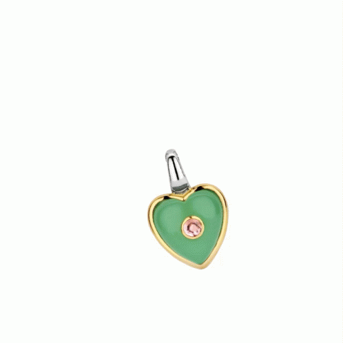 small metal charm with green heart in light blue