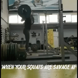there is a person lifting a heavy barbell