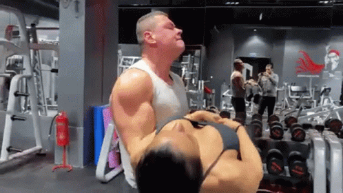 a man with a huge gym bag on his back in a gym