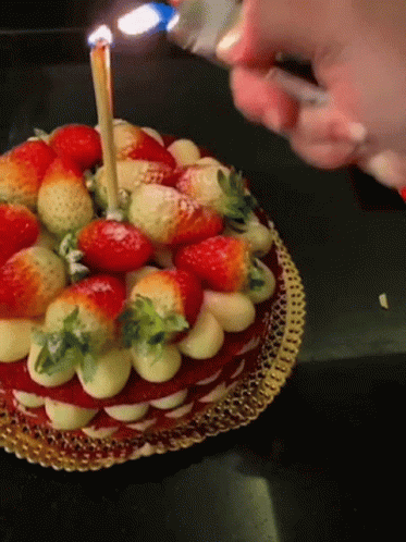 a cake with several different colored objects on top