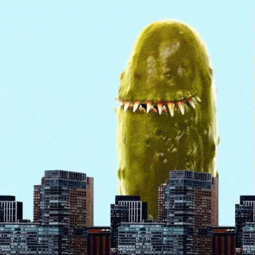 a big poster of a monster sticking out of a city building