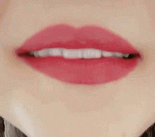 a lips - like image with a white lip and long eyelashes