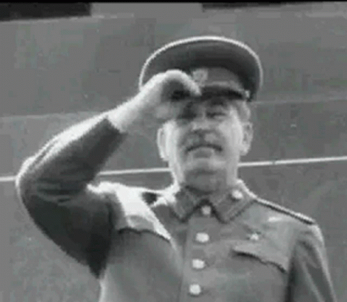 a man in a uniform saluting soing